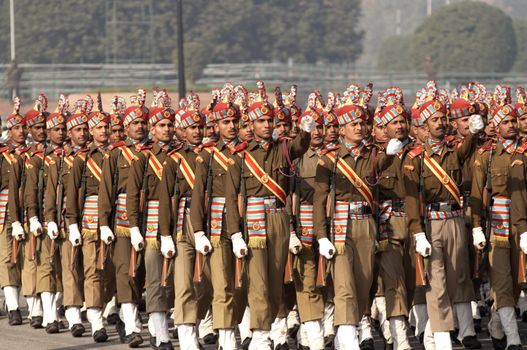 Soldiers in brightly colored uniform parade during the Republic Day celebrations in New Delhi, India