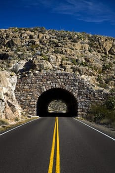 Image of a highway heading into a tunnel