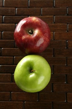 Sweet fruit, apples on a brown tablecloth