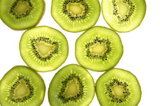 Kiwi green transparent slices over white background