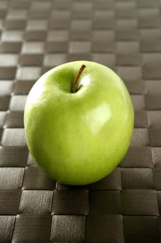 Sweet fruit, apples on a brown tablecloth