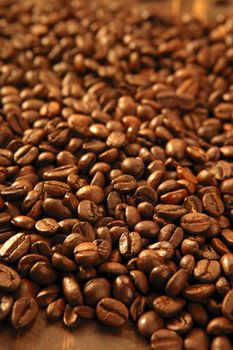 Toasted coffe beans texture under golden light