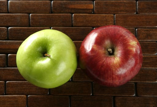 Sweet fruit, apples on a brown tablecloth