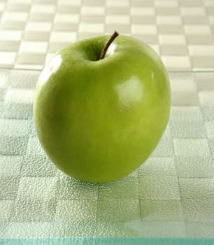 Sweet fruit, apples on a brown tablecloth