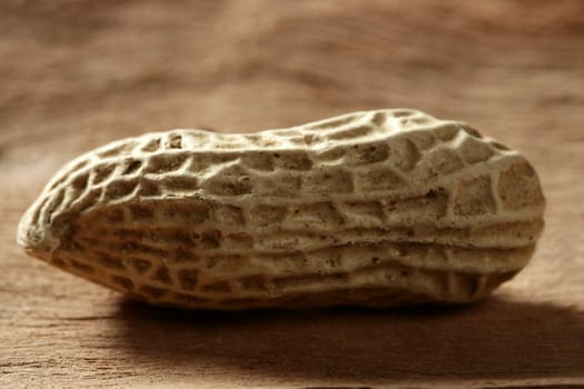 Peanuts macro over warm wood background