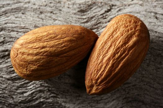 Almond macro over wood background, warm image