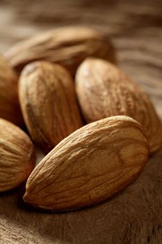 Almond macro over wood background, warm image