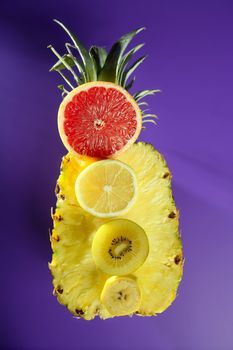 Pineapple with citrus, kiwi and banana slices dessert