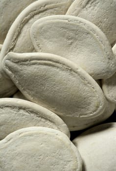 white dried pumpkin seeds in a crop macro studio shot