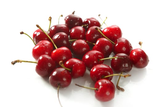 Cherry red fruits texture on white background