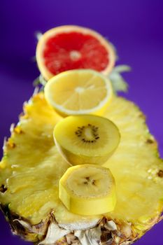 Pineapple with citrus, kiwi and banana slices dessert