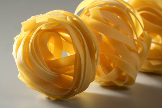 Dried macro noodles yellow pasta, studio shot texture