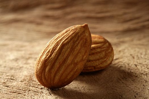Almond macro over wood background, warm image