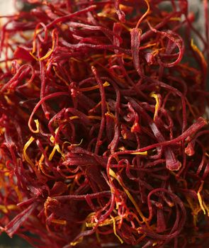Saffron, appreciated red spice in vivid red orange color macro texture crop