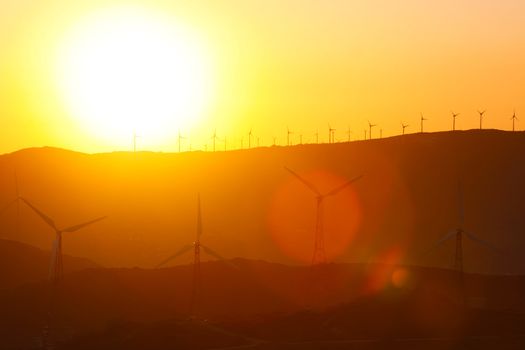 Wind turbines farm at sunset in southern Spain.