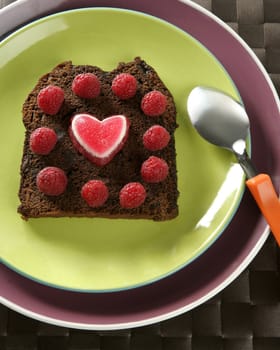 Lovely raspberryes and heart cake. Valentine. Brown bread