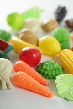 Plastic game, fake varied vegetables and fruits. Children food education toy