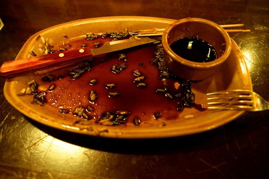 End of lunch, diner, dirty table, golden light