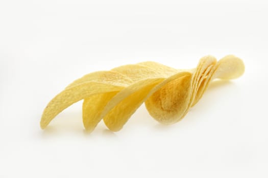 Potato salted chips slices over white background