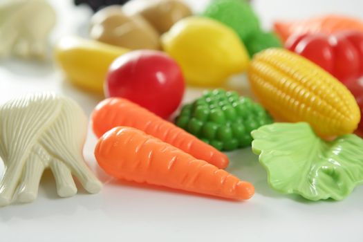 Plastic game, fake varied vegetables and fruits. Children food education toy