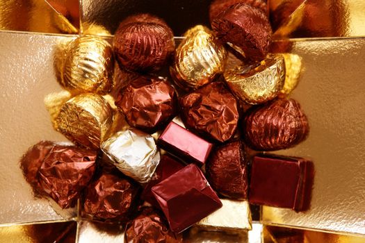 Golden colorful chocolate goden wrap, holiday metaphor