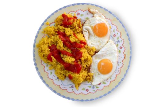 Delicious Spanish rice with tomato and two eggs on victorial dish