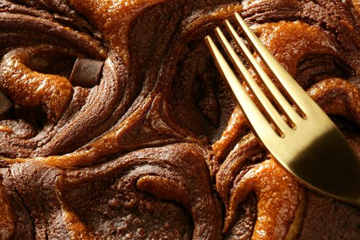 Chocolate cake crop macro texture, golden light, studio shot