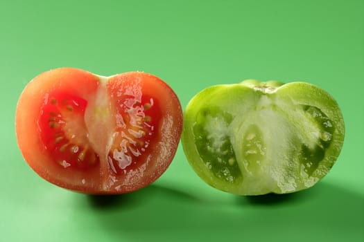 Two color tomatoes, green and red variety, studio shot