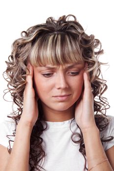 Young beautiful woman with the headache is touching her temples.  Isolated over white background