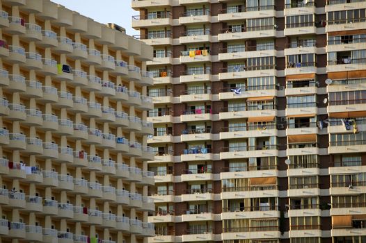 Old condominium facades texture in Spain, vacation overcrowding