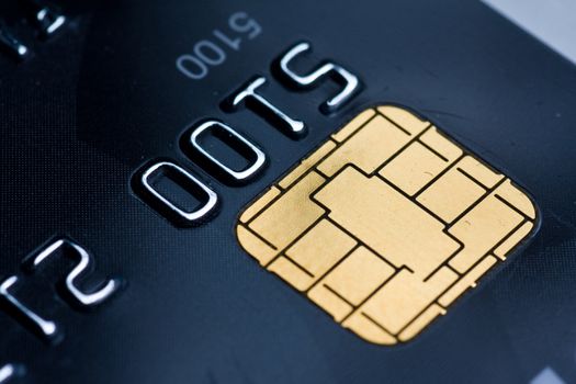 Closeup of a credit card with a gold chip