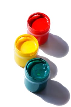 tubes with acrylic paint organized as traffic light and isolated against white background
