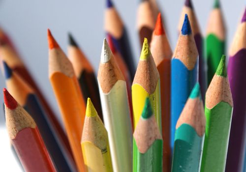 set of colored crayons isolated against white background