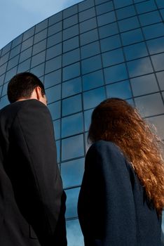 Business people looking good expectations on modern building background