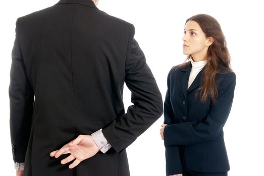 Business concept fingers crossed in front of boss isolated on white background