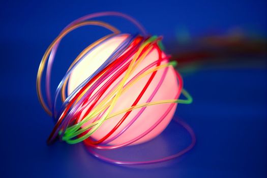 Glowing sphere with colorful wires such a wired communication metaphor