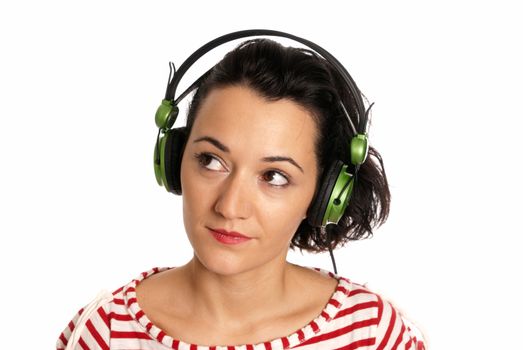 Young woman listening music with headphones isolated on white background