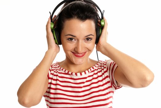 Young woman listening music with headphones isolated on white background