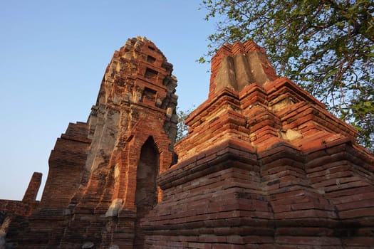 THAILAND, Ayutthaya, the ruins of the city's ancient temples at sunset