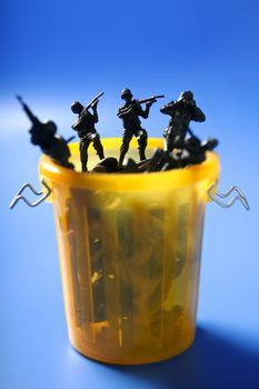 Toy soldiers row on the trash, end of war metaphor, peace