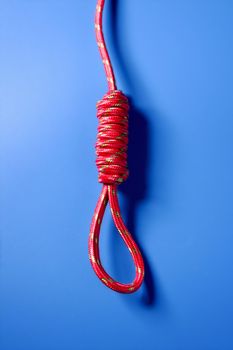 Hangman knot in red thread such a crisis metaphor