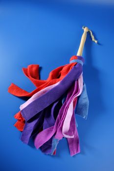 Housewife colorful duster cleaning tools over blue background
