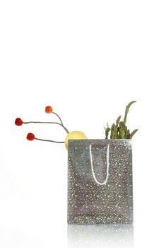 surreal silver vegetables shopping food bag isolated over white