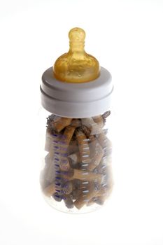 Tobacco addiction metaphor with baby bottle full of cigarettes