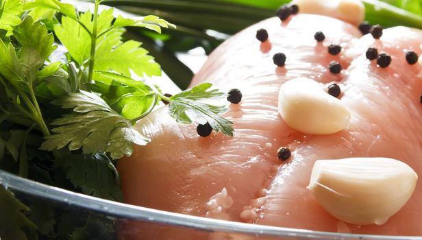 raw chicken breast with vegetables ready to be prepared