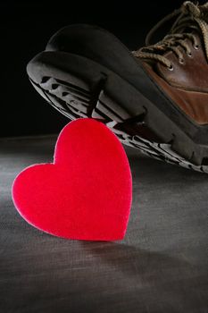 Kill the love or health metaphor. Boot treading a red valentines heart