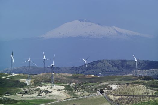 ITALY, Sicily, Francofonte/Catania province, countryside, Eolic energy turbines, the volcano Etna in the background