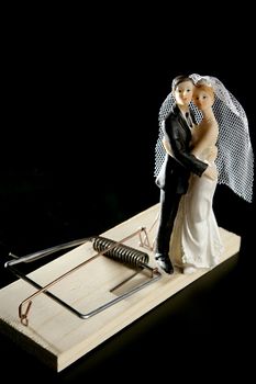 Marriage seen as a mouse trap classic male idea isolated over black