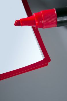 Blank copy space notebook with red big pen marker over