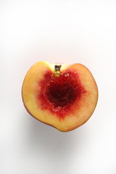 Metaphor of bloody inside of half peach